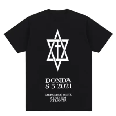 A commemorative T-shirt featuring the text "Donda 8/5/2021." The shirt celebrates the release date of Kanye West's "Donda" album with a simple yet impactful design.